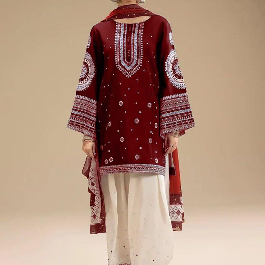 Maroon embroidered traditional outfit with white pants on a beige background.Elegant Pakistani winter 3pc suit in linen fabric